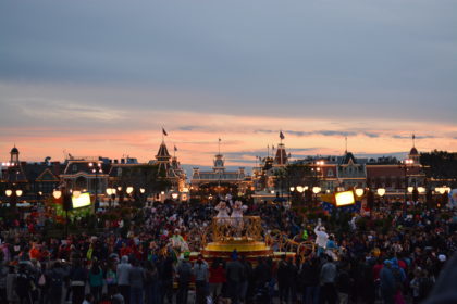 View of the hub in Magic Kingdom at sunset as Mickey and Minnie lead the Move It, Shake It, MousekaDance It Street Party
