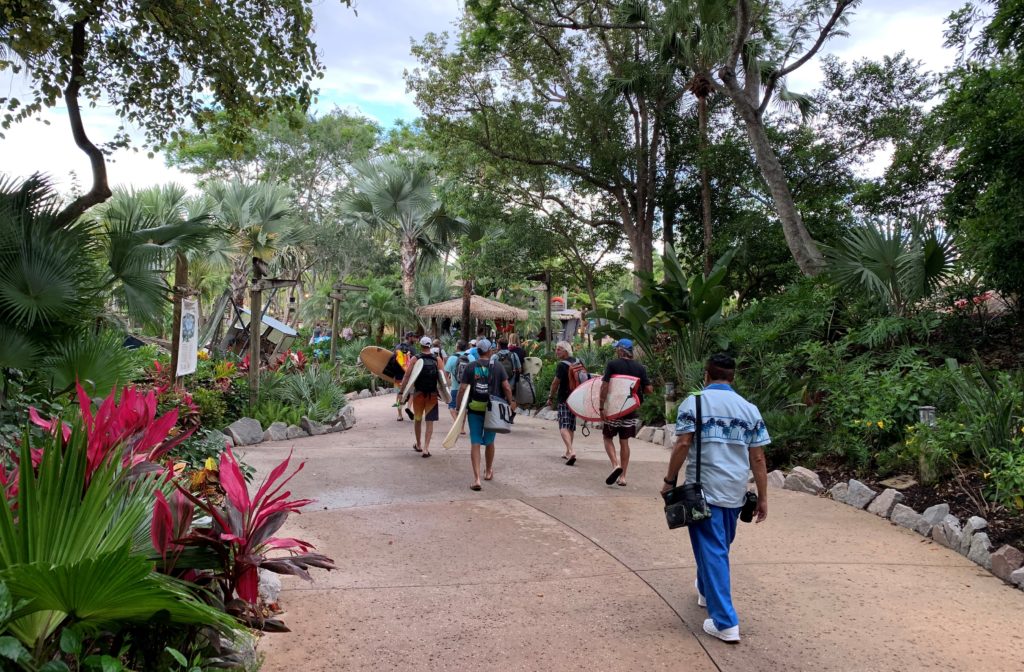 A group heading to a private surf event at Disney’s Typhoon Lagoon water park.