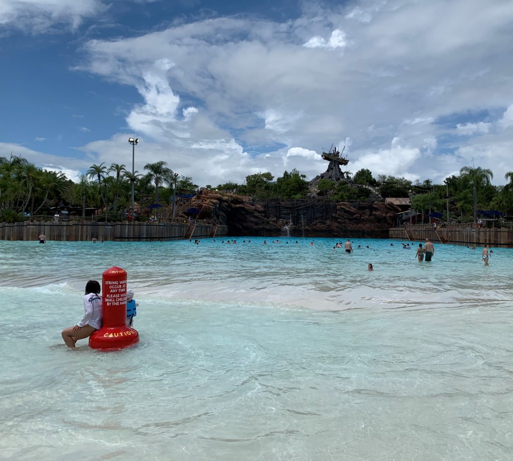 The largest wave pool in North America is at Typhoon Lagoon and is pictured with guests enjoying the water.