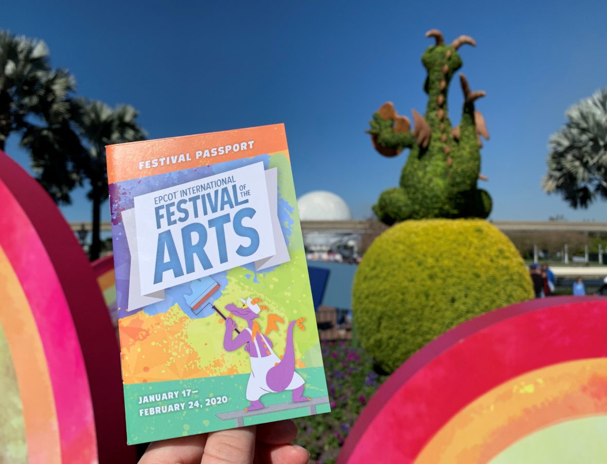 2020 Epcot International Festival of the Arts: Best of the Fest - Festival Passport in front of rainbows and Spaceship Earth.